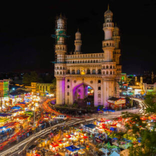 Long Exposure Shot of Traffic moving around Charminar during ramadan season on the night of eid in hyderabad, india.